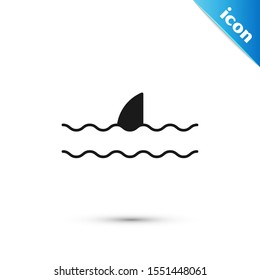 Black Shark fin in ocean wave icon isolated on white background.  Vector Illustration