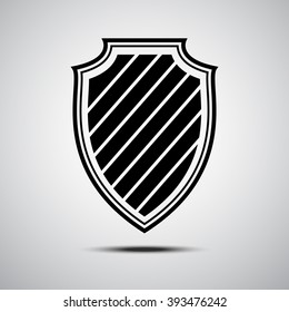 Black shield icon on grey background. Vector shield illustration