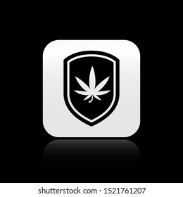 Black Shield and marijuana or cannabis leaf icon isolated on black background. Marijuana legalization. Hemp symbol. Silver square button. Vector Illustration