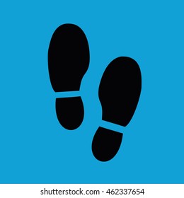 Black shoe print icon vector illustration. Blue background