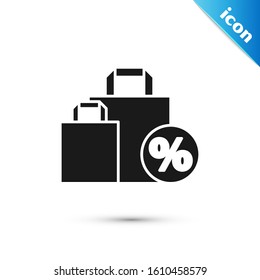 Black Shoping bag with an inscription percent discount icon isolated on white background. Handbag sign.  Vector Illustration