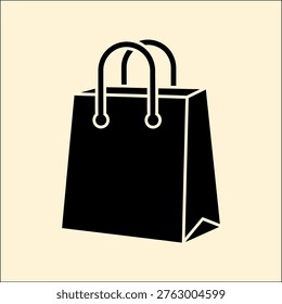 Black shopping bag with two handles on pale beige