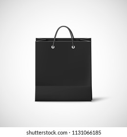 Black shopping paper bag. Template of empty black cardboard bag. Vector illustration isolated on white background