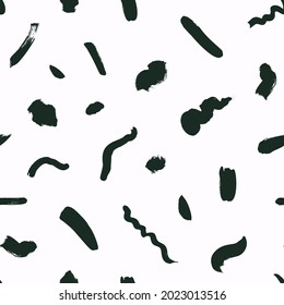 Black short lines and dots on white background. Geometric vector seamless pattern in Memphis style. Hand drawn grunge brush strokes and dots. Organic ink illustration with dashes and wavy lines. 