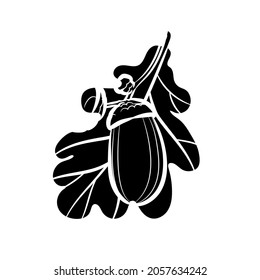 Black silhouette of acorn and oak leaf on white background. Graphic drawing. Vector illustration.