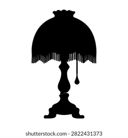 Black silhouette of an antique table lamp with ornate base and fringed lampshade, isolated on white background, vintage home decor style.