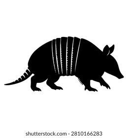 A black silhouette of an armadillo showcasing its distinctive armored shell and elongated body, set against a plain white background.