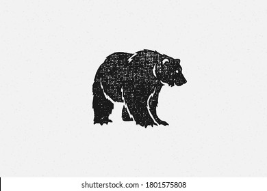 Black silhouette of bear as symbol of wild fauna in nature hand drawn stamp effect vector illustration. Vintage grunge texture on old paper for poster or label decoration.