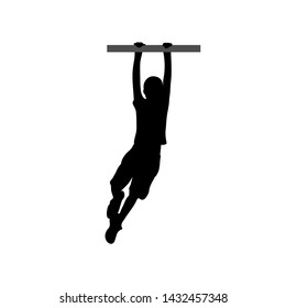 Black silhouette of a boy hanging on the horizontal bar. 