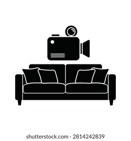 Black silhouette of a camera positioned above a comfortable sofa
