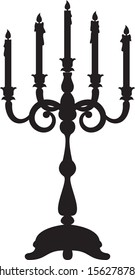 Black silhouette of candelabrum with five candles