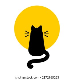 Black silhouette of a cat on a background of a yellow moon.