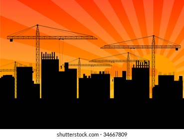 Black silhouette of crane on the sunset background.
