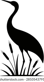 Black silhouette of a crane standing in tall marshland plants and reeds