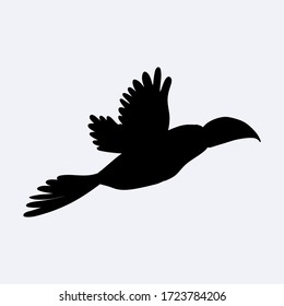 Black silhouette of a cute flying toucan. Vector illustration