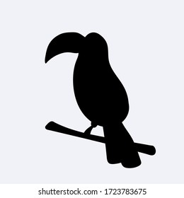 Black silhouette of a cute toucan sitting on branch. Vector illustration