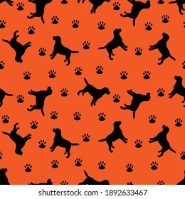 Black silhouette of a dog on a orange background. Vector illustration. Seamless pattern.	