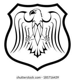 Black silhouette of an eagle in the shield