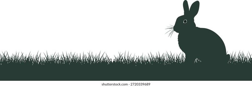 Uma silhueta preta de um coelho da Páscoa sentado em um campo no dia da Páscoa com um fundo branco brilhante