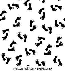 Black silhouette foot. Seamless pattern. Human footprint. Icon. Isolated on white background. Vector illustration
