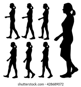 Black silhouette of a girl, a woman. Girl, a woman on the move. Girl, woman with a tail on the head. Set of seven silhouettes of girls going sideways. Girl walks leisurely pace. Human body. Vector.