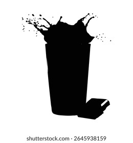 Black silhouette of a glass with chocolate milk splashing high A piece of chocolate rests beside the glass against a .