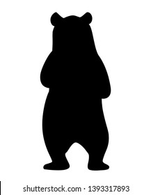 Black silhouette. Grizzly bear. North America animal, brown bear. Cartoon animal design. Flat vector illustration isolated on white background. Bear stand on two legs, back view.