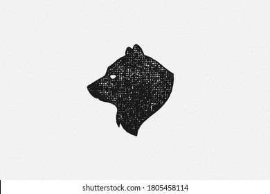 Black silhouette of head wild bear as countryside exploration symbol hand drawn stamp effect vector illustration. Vintage grunge texture on old paper for poster or label decoration.