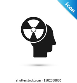 Black Silhouette of a human head and a radiation symbol icon isolated on white background.  Vector Illustration