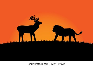 The black silhouette of a lion encounters a moose on a grassy hill with an orange background.