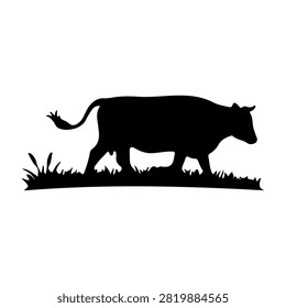 Black silhouette of a lion walking on grass, emphasizing strength and wilderness in a natural setting.