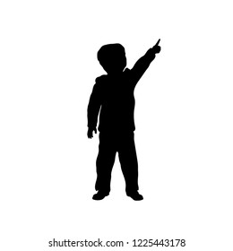 Black silhouette of little boy pointing to sky. Kid in winter clothes. Vector illustration