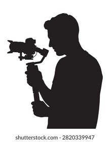 Black silhouette of a man holding a modern camera stabilizer gimbal to record smooth video footage outdoors.