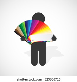 black silhouette of a man holds developed color swatches palette with bright colors