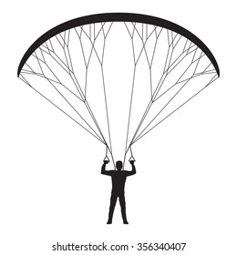 Black silhouette of a man with a paraglider. Paraglider. Paraplane. Kite. 