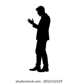 A black silhouette of a man standing with hands clasped in prayer, conveying spirituality, faith, and contemplation against a plain background.