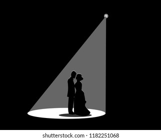 Black silhouette of a married couple The white spotlight is splashed down.