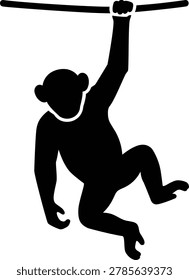 A black silhouette of a monkey hanging from a branch