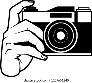 Black Silhouette Old Fashion Still Image Camera hold by hand pressing the button vector graphic design