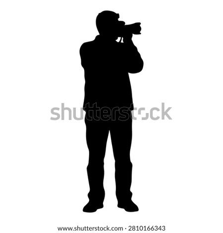A black silhouette of a person holding a camera up to their eye, capturing a photograph, set against a plain background.