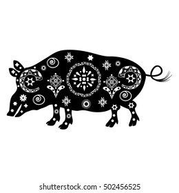 black silhouette of a pig with a pristine white patterns and ornaments in Chinese style calendar or the African style of ancient tribes and shamanic rituals, traditions