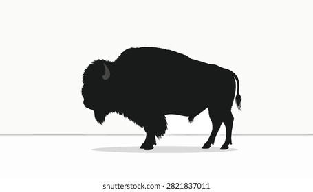 Black silhouette of a powerful bison with large hump and horns