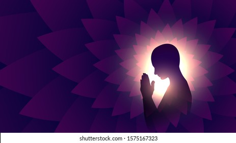 Black silhouette of a praying person, a Buddhist on a background of bright light, a man meditating