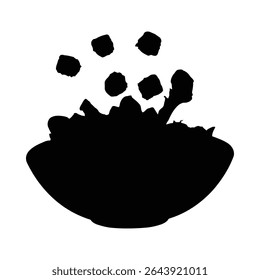 Black silhouette of salad with cubes falling into a bowl isolated on white background