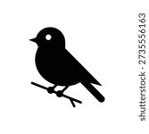 Black silhouette of a small bird sitting on a branch