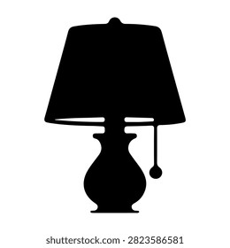 Black silhouette of a traditional table lamp with a lampshade and pull chain, isolated on a white background, emphasizing classic lighting design.