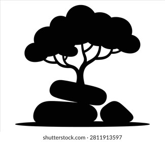 Black silhouette of a tree growing on top of large smooth rocks