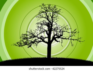 Black silhouette of tree on the green.