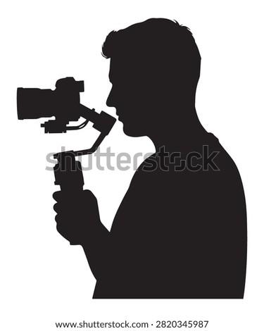 A black silhouette of a videographer holding a camera stabilizer gimbal to capture smooth and cinematic video shots.