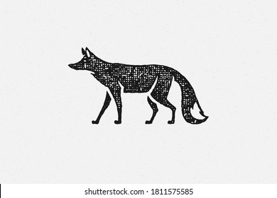 Black silhouette of wild fox walking as symbol of wildlife in countryside hand drawn stamp effect vector illustration. Vintage grunge texture on old paper for poster or label decoration.